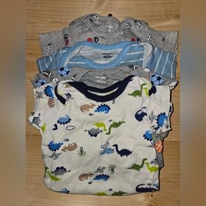 4 cute onesies 1 9 month and 3 12 months.